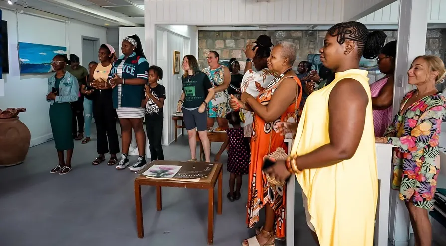 Guests at the opening reception for Bloom Where You're Planted at Charlestown Gallery