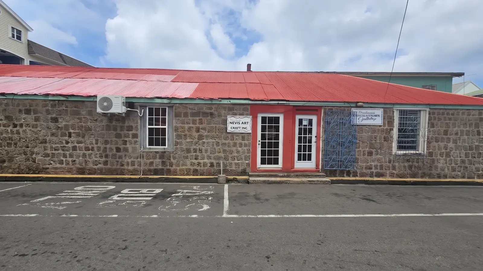Charlestown Gallery storefront on Main Street, Charlestown, Nevis, with entrance signage